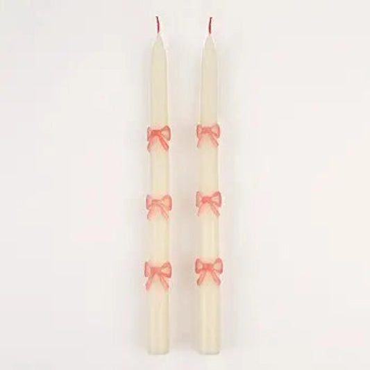 Velas cónicas con lazo rosa