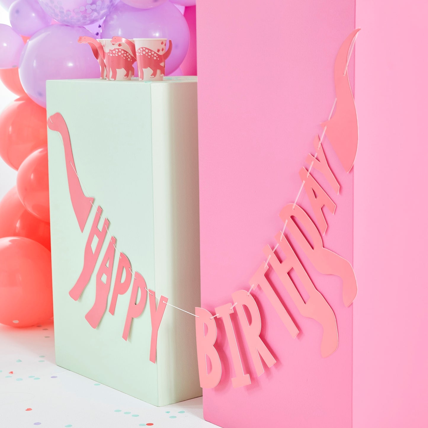 Banderín rosa con forma de dinosaurio feliz cumpleaños